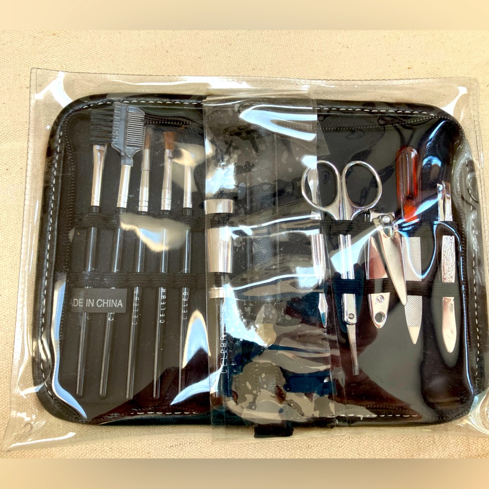 Never opened zip open case w/ manicure tools and MakeUp brushes.